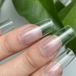 100pcs Transparent Nails and 2 pcs fake nails glue .